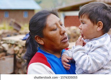 Native American Woman Comforting Her Little Son.