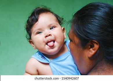 Native American Woman With Her Playful Baby Boy.