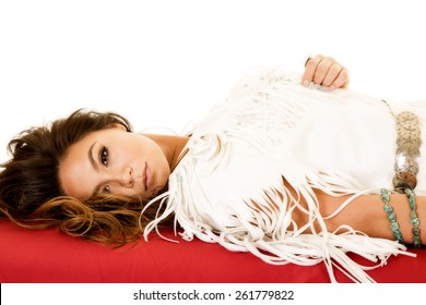 A Native American Woman Laying Down Looking To The Side.