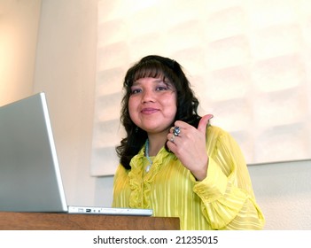 Native American Woman Thumb Up And Happy By Her Laptop