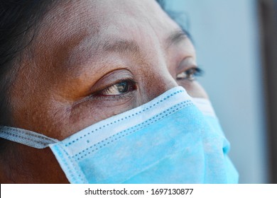 Native American Woman Wearing Mask.