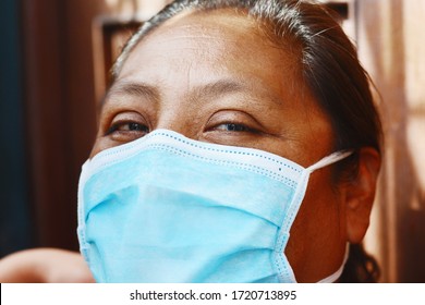 Native American Woman Wearing Mask.