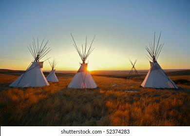 Native North American tipis at sunrise on the plains