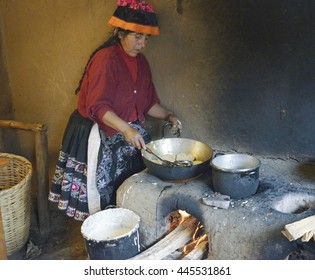 Native Peruvian Woman Preparing Cachangas Aka Fried Bread On A Primitive Stone Oven. October 22, 2012 - Paru Paru, Peru