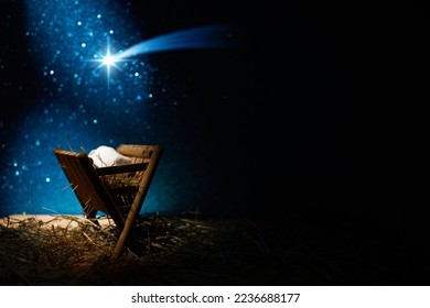 Nativity of Jesus, empty manger at night with bright lights. - Shutterstock ID 2236688177