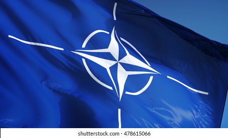 NATO Flag Waving Against Clean Blue Sky, Close Up, Isolated With Clipping Path Mask Alpha Channel Transparency