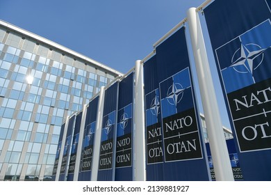 NATO Logo Flags In Front Of The Headquarters Building In Brussels, Belgium, 2022.