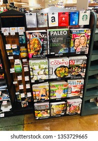 Natomas, CA - March 26, 2019: Magazine Rack Inside Grocery Store Checkout Area. 