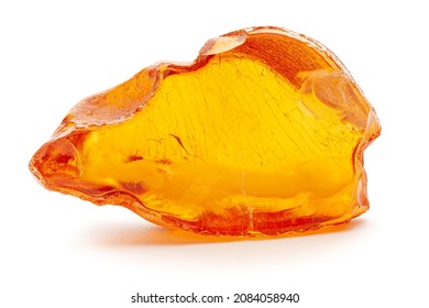 Natural amber. A piece of yellow opaque natural amber on white background.: stockfoto