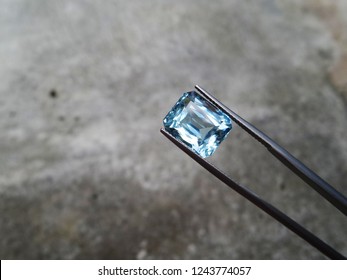 Natural Aquamarine Gemstone With Cement Wall Background