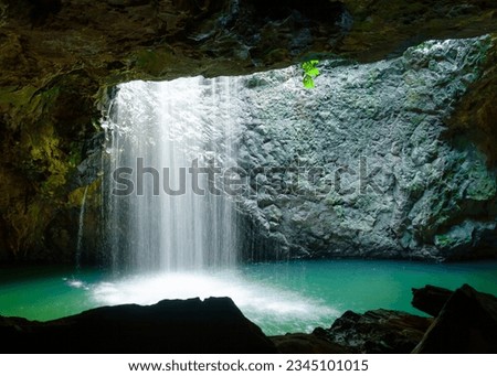 Natural Arch waterfall, a top tourist destination on the Gold Coast on the East coast of Australia.