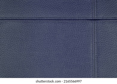 Natural, artificial blue leather texture background with decorative seam. Material for sport items, clothes, furnitre and interior design. ecological friendly leatherette.