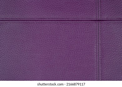 Natural, artificial purple leather texture background with decorative seam. Material for sport items, clothes, furnitre and interior design. ecological friendly leatherette.