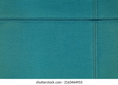 Natural, artificial turquoise leather texture background with decorative seam. Material for sport items, clothes, furnitre and interior design. ecological friendly leatherette.