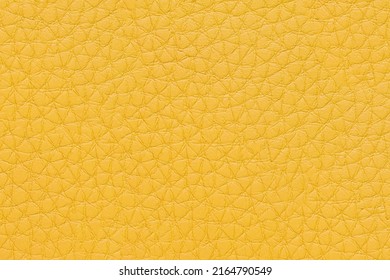 Natural, artificial yellow leather texture background. Material for sport items, clothes, furnitre and interior design. ecological friendly leatherette.