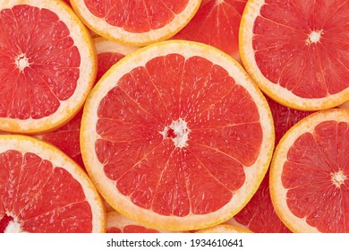 Natural backdrop of sliced round grapefruites