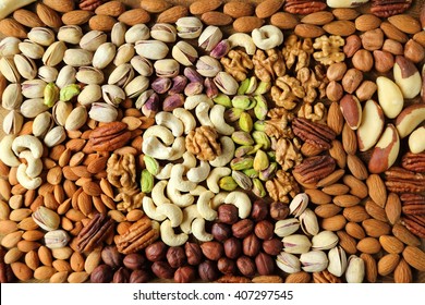Natural background made from different kinds of nuts. - Shutterstock ID 407297545
