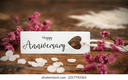 Natural Background With Purple Blossoms and Label With the English Word Happy Anniversary, Summer or Autumn Decoration - Shutterstock ID 2317743363