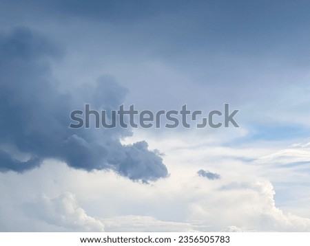 Natural background sky. Blue sky with clouds and sun. Cirrus Clouds Painting the Sky in Gentle Hues. Blue sky with clouds