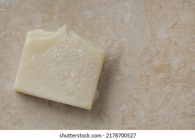 Natural Bar Soap For Healthy Skin And Hair.
Hydrating Cleansing Bar On Stone Textured Plain Background.