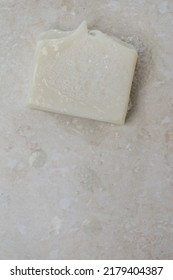 Natural Bar Soap For Healthy Skin And Hair.
Hydrating Cleansing Bar On Stone Textured Plain Background.