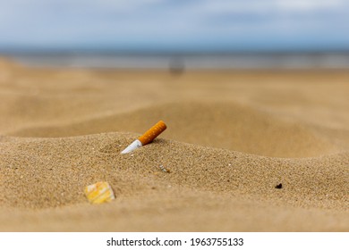 Natural Beach With Cigarette Butt Litter