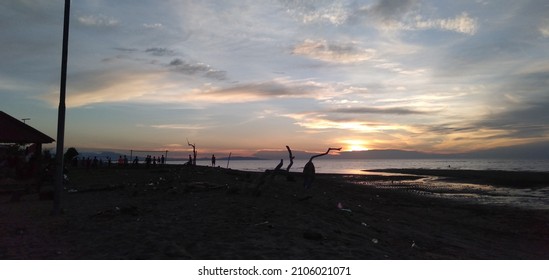 Natural Beach, Sunset And Childern Playing Soccer View