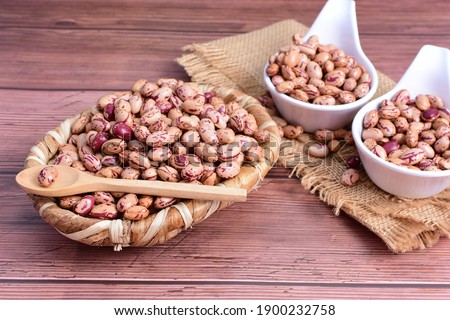 Natural bean grains, Phaseolus vulgaris on wooden background with dark veins
