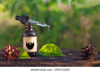 Natural beard oil, brown bottle. Cosmetic for beard or aromatherapy in glass bottle Copy space.