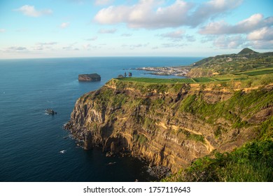 Natural and beautiful landscape of a cliff with the sea in the background from the viewpoint do Ponta do Escalvado during the sunset on the island of Sao Miguel azores Portugal