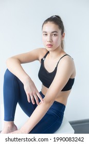 Natural Beauty Brunette Model No Make Up In Sport Wear Posing In Studio On Isolated Background. Model Tests, Natural No Make Up Models Concept