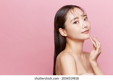 Natural Beauty Concept Of A Young Asian Woman On A Pink Background