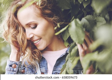 Natural Beauty Of Women Between Leaves