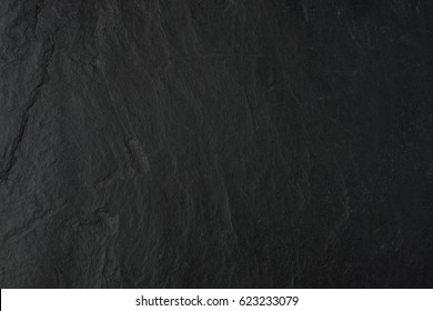Natural black stone background - Shutterstock ID 623233079