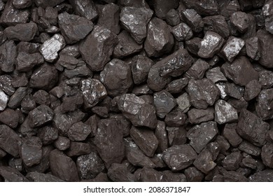 Natural Black Stone Coal Background Top View. Fossil Fuel Coal Lumps Texture.