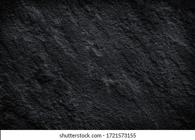 natural black stone texture or dark grey black slate background. abstract black stone pattern.