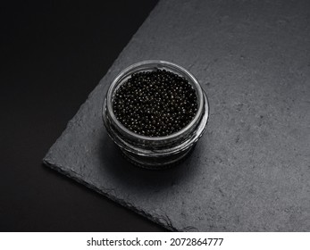 natural black sturgeon caviar in a glass jar - a delicacy of Russian cuisine