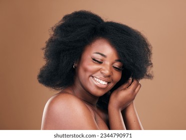 Natural, black woman and hair care with beauty, smile and luxury on a brown studio background. Afro, hairstyle and African model with mockup space, aesthetic and shine with salon treatment and growth
