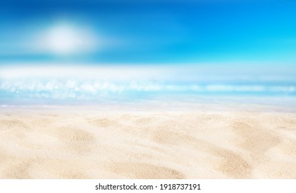 Natural blurred defocused background for concept summer vacation. Nature of tropical summer beach with sun in haze. Light sand beach, ocean water sparkles against blue sky.