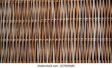 Natural braided background of basket of brown tubes twisted from paper. Wicker surface of a rustic craft basket made of eco vines, paper, close up of strips pattern. Hobbies and craft concept. - Shutterstock ID 2175035685