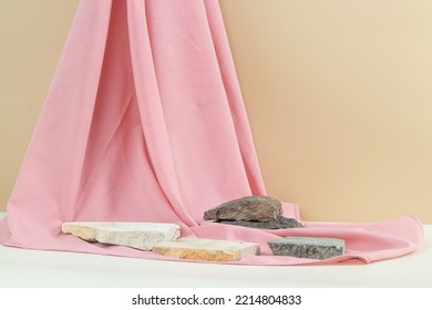 Natural Brown And White Background With Natural Stones And Soft Pink Fabric