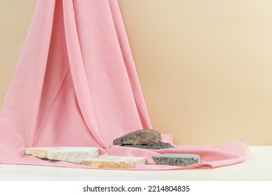 Natural Brown And White Background With Natural Stones And Soft Pink Fabric