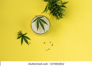 Natural Cannabis Cream, Hemp, Moisturizing CBD Lotion. Cosmetic Product. On A Yellow Background