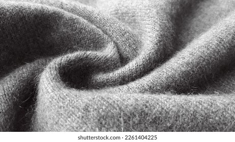 Natural cashmere gray fabric. Knitwear. Cashmere, wool. Texture of natural wool fabric.