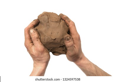 Natural clay piece in hands  isolated on white background.  Wet clay material for sculpting or modeling.
