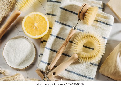 Natural cleaning products lemon and baking soda with bamboo dish brushs. Eco friendly. Zero waste concept. Plastic free.