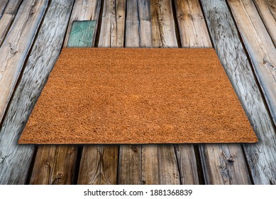 Natural Coir Doormat On Antique Wooden Texture, Background