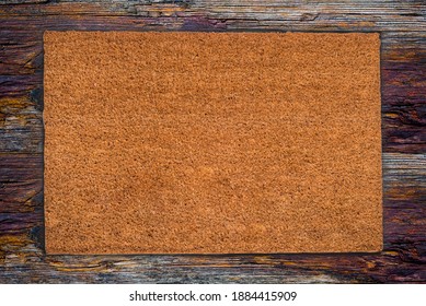 Natural Coir Doormat On Antique Wooden Texture, Background