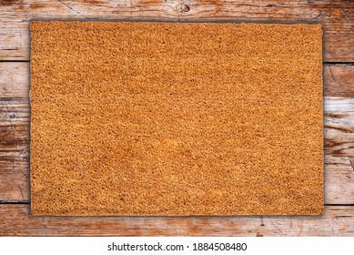 Natural Coir Doormat On Antique Wooden Texture, Background