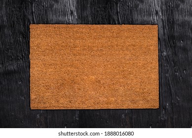 Natural Coir Doormat On Antique Wooden Texture, Background